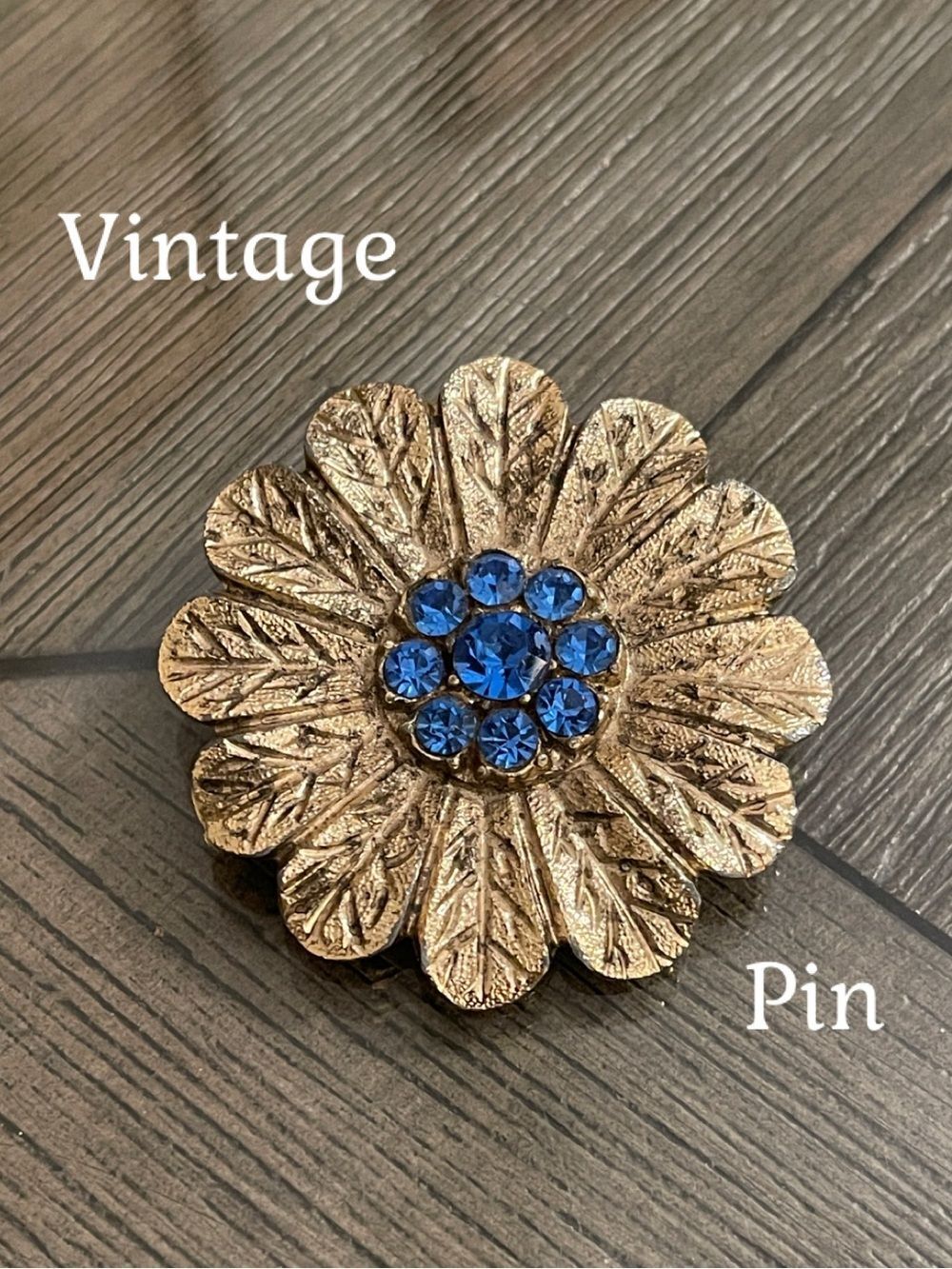 Vintage 1960s Pale Gold-tone Flower Brooch with Vibrant Blue Rhinestone Center